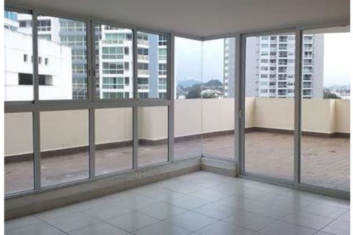 Living area with sliding doors to balcony in PH Nuevo Betania Panama