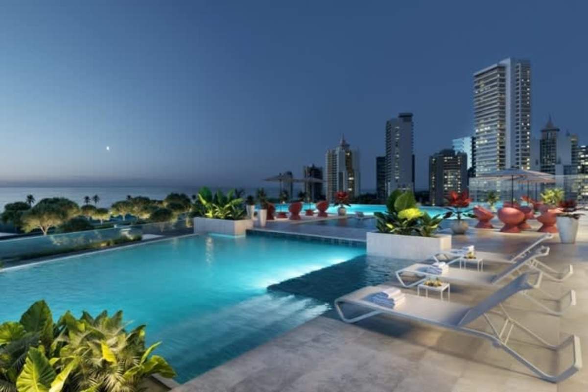 Luxury rooftop infinity pool with sun loungers overlooking city skyline and Pacific in PH Costanera