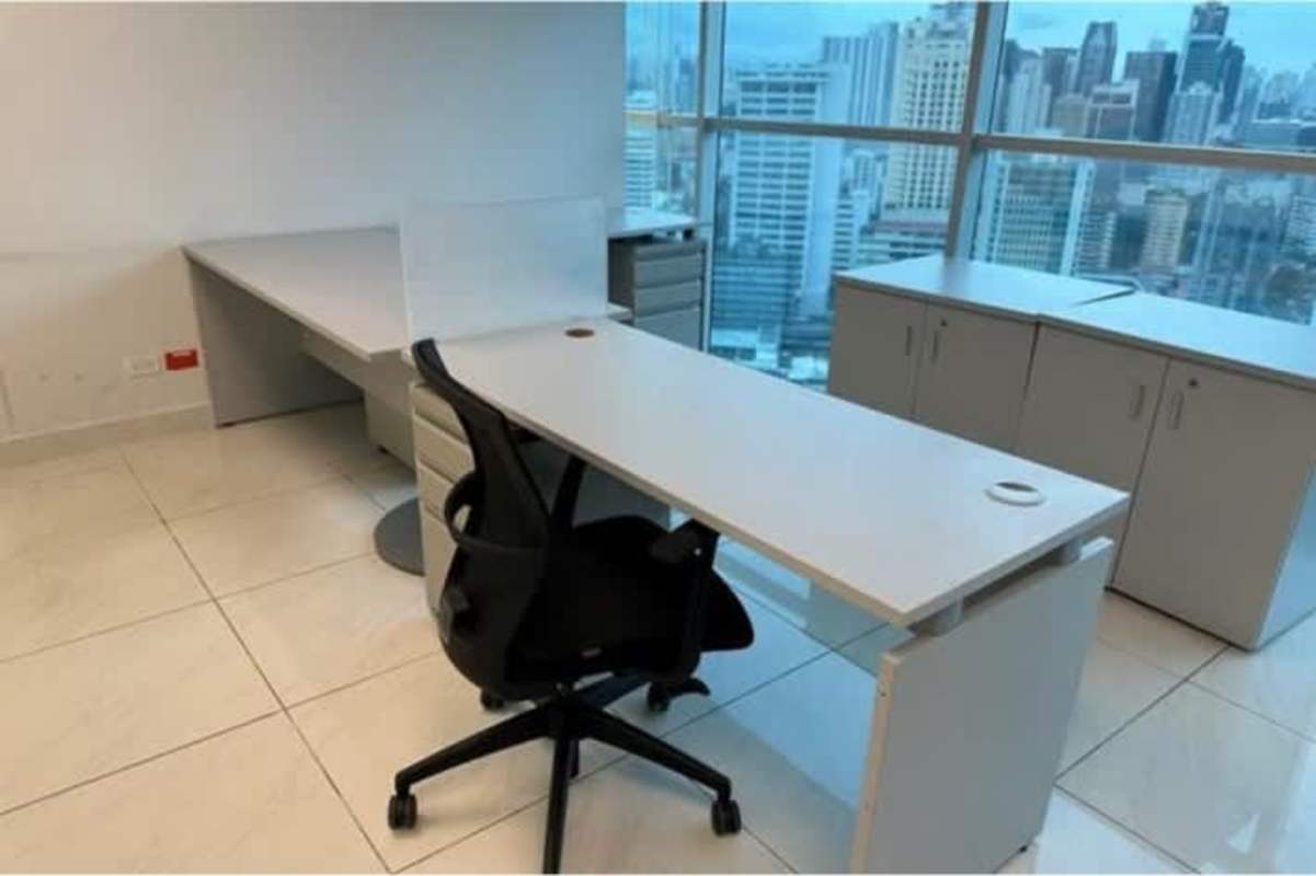 Contemporary open office with glass partitions and natural light in PH Hi Point Panama