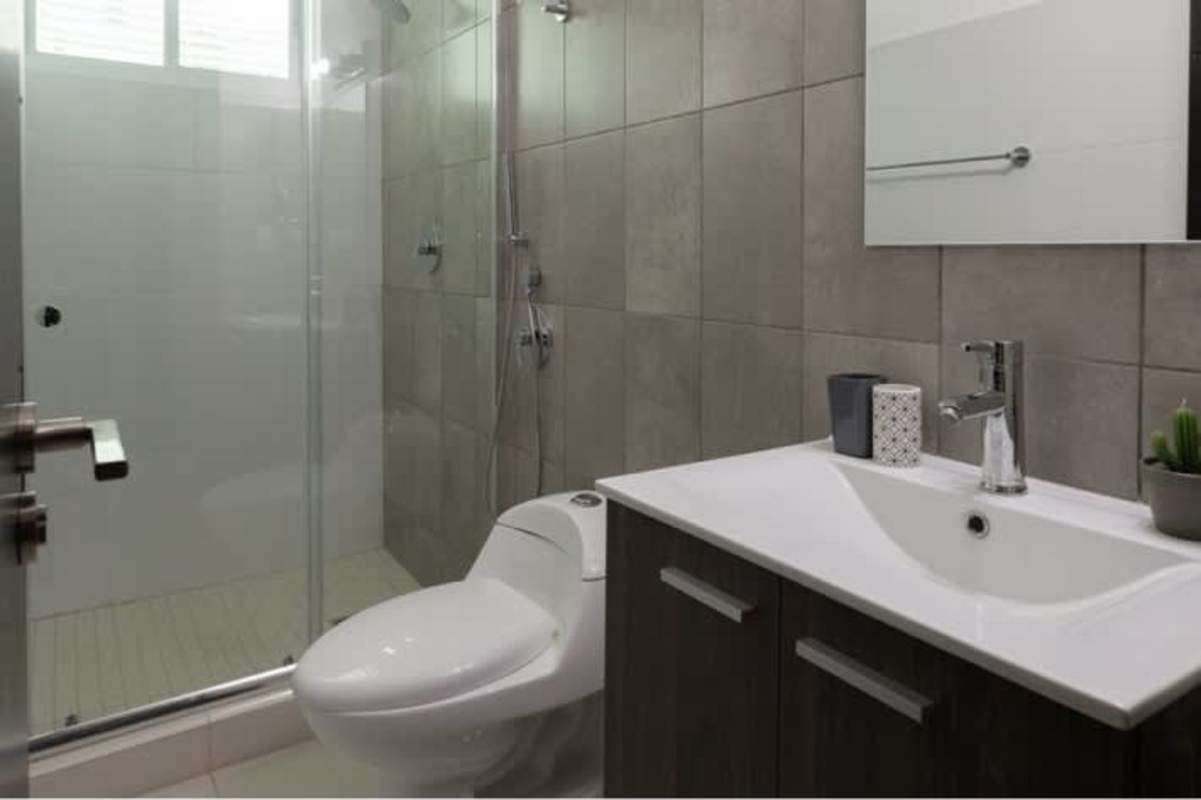 Modern kitchen granite countertops stainless appliances washer dryer PH Atrium Tower San Francisco Panama