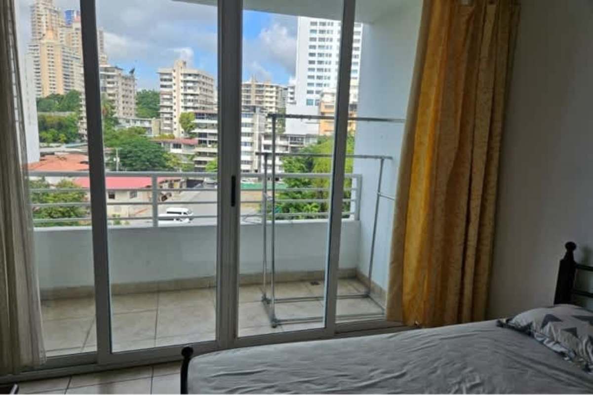 Bedroom with access to balcony and city views in PH Kubic 2 El Cangrejo Panama