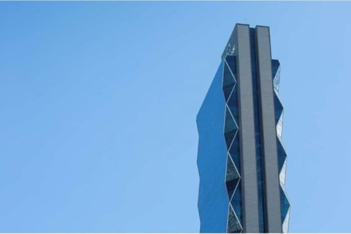 Interior commercial office workspace with glass partitions and marble floors in PH Hi Point Tower Panama