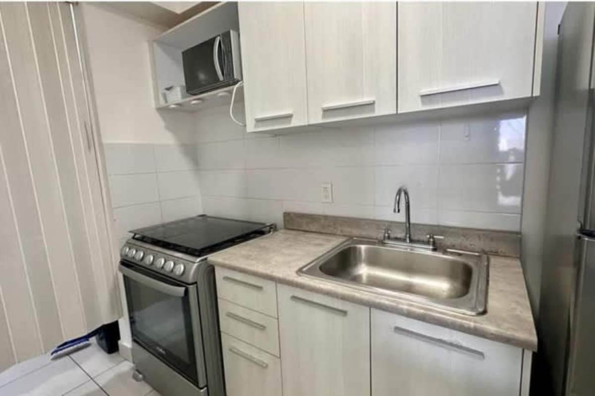Minimalist bedroom with tile floor closet blackout shade PH ILO
