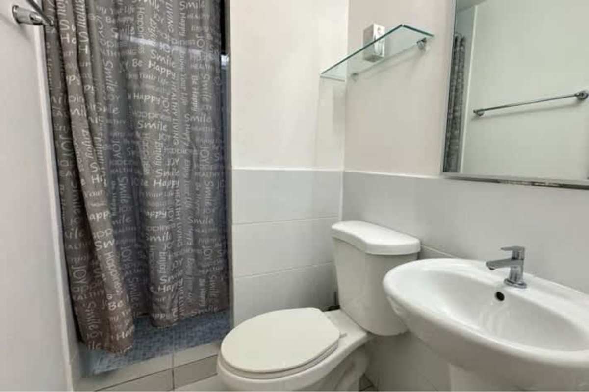 Compact bathroom with shower, pedestal sink, tile PH ILO Pedregal