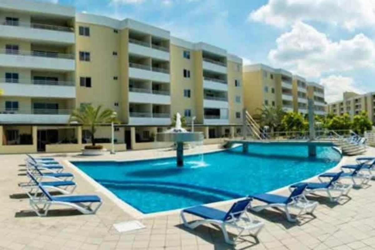 Modern apartment living room with large balcony doors at PH Camino de Cruces Panama City