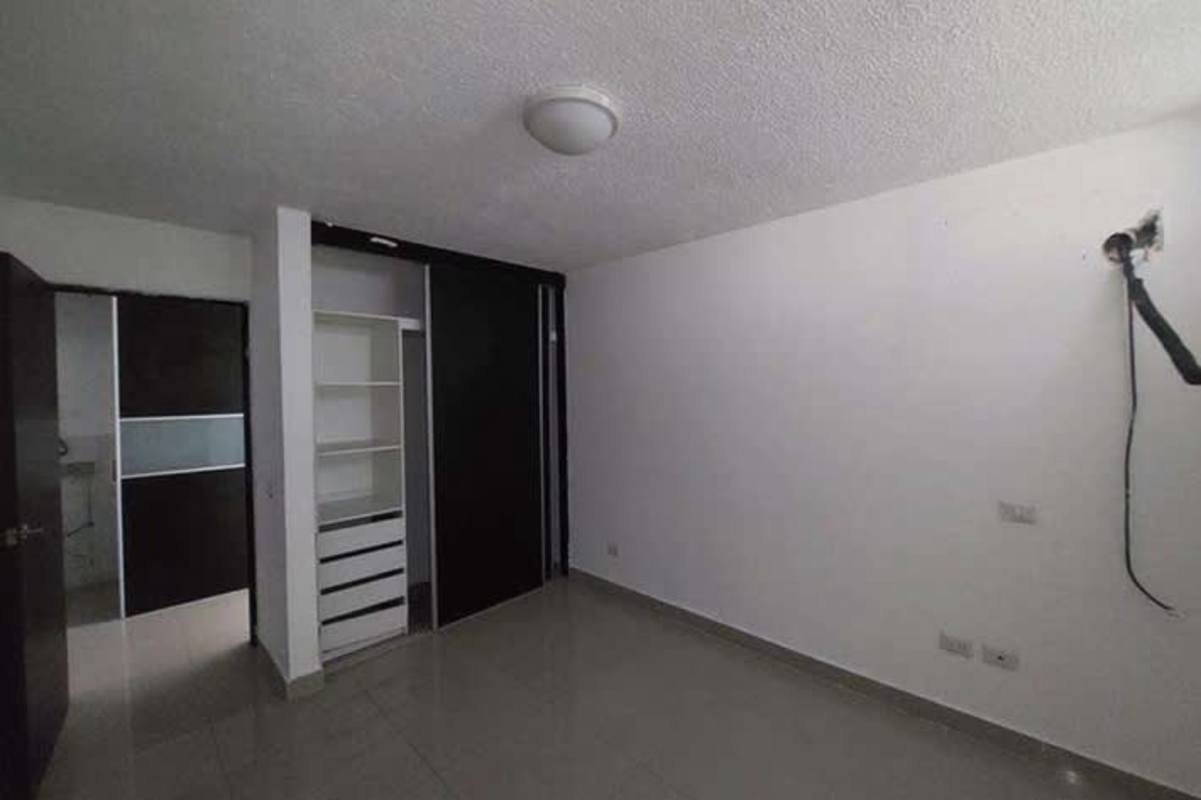 Modern residential apartment building with balconies and parking in Ancón Panama