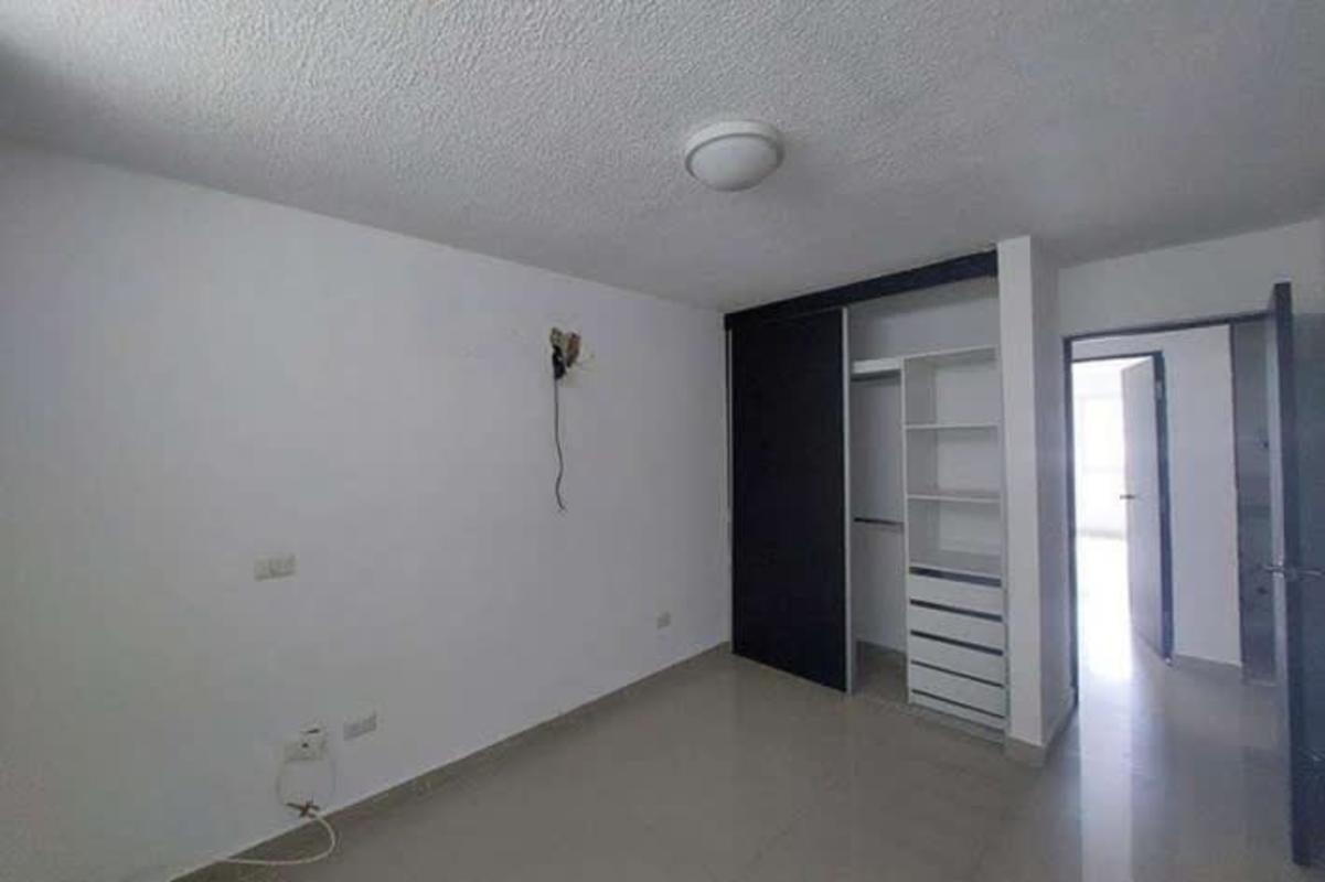 Bedroom with wardrobe and mountain view window in Ancón Panama