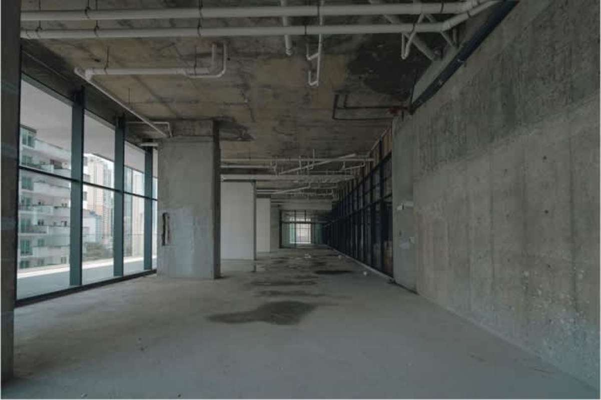 Unfinished interior with concrete floors and big windows commercial space Panama City