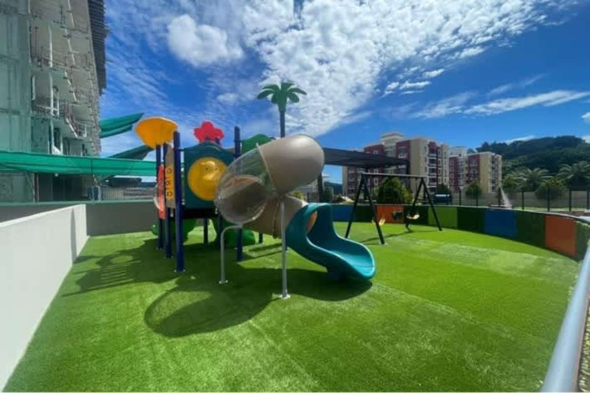 Colorful outdoor playground with slide and swings PH Condado Plaza Condado del Rey Panama City