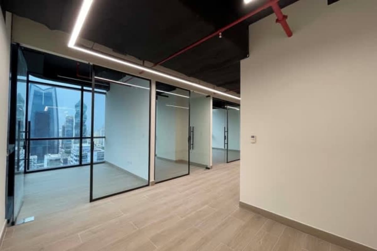 Modern office with glass partitions and city views in Towerbank Financial Center Panama City