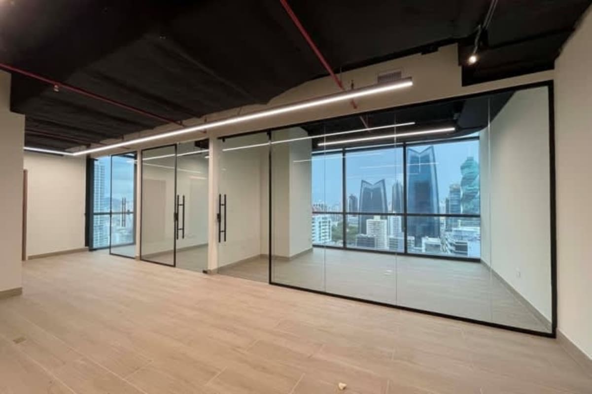 Modern open plan office with panoramic skyline views in Tower Financial Center Panama City