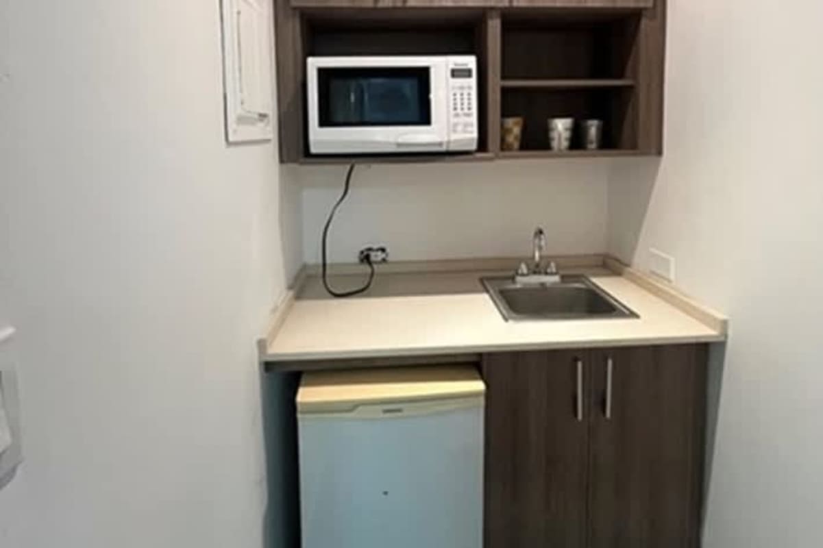 Office with floor-to-ceiling window, glass desk, hardwood floor in PH BICSA Tower Obarrio Panama