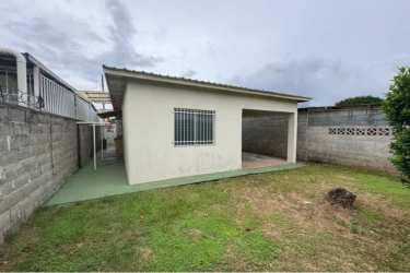 Bright bedroom with ceramic tile floor and security barred window in affordable suburban house