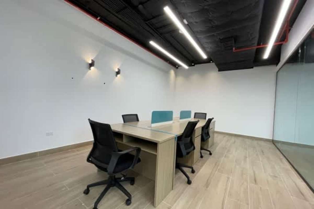 Shared workspace featuring glass divider walls in office rental Tower Financial Center Panama