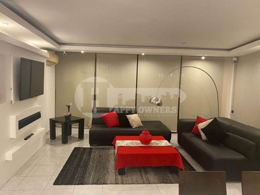 Contemporary dining and living space with balcony and panoramic windows at PH Royal Princess Punta Paitilla