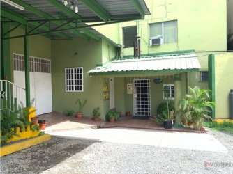 Spacious guest room with AC, tiled floors, large bed and balcony access hotel Panama