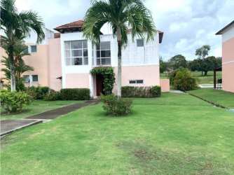 Spacious bedroom with vaulted ceiling, ceiling fan, two beds and large garden window in Río Hato villa
