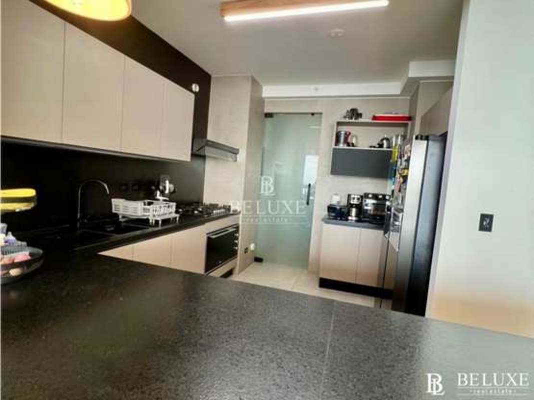 Luxury bedroom with expansive window ocean view at PH Victory Wellness Coco del Mar Panama City