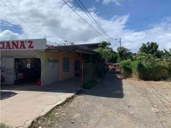 Large open interior industrial warehouse space with high metal roofing