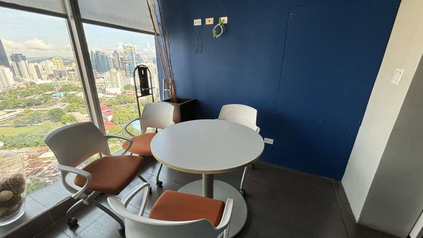 Private office with large window and minimalist furniture in Oceania Business Plaza Panama City