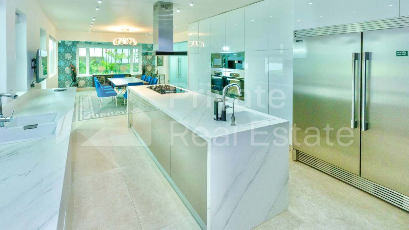 Spacious modern living room marble flooring large windows garden views Altos del Golf Panama mansion