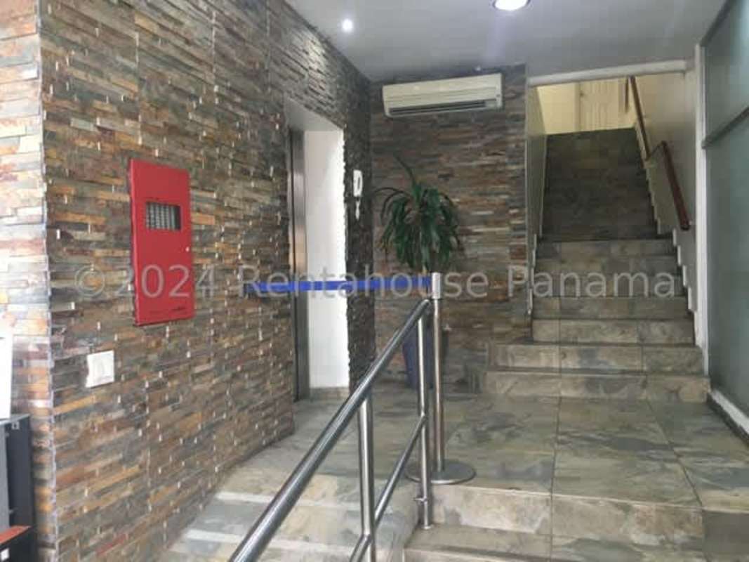 Meeting room with glass windows, city view, and modern furnishings Elah Building Panama