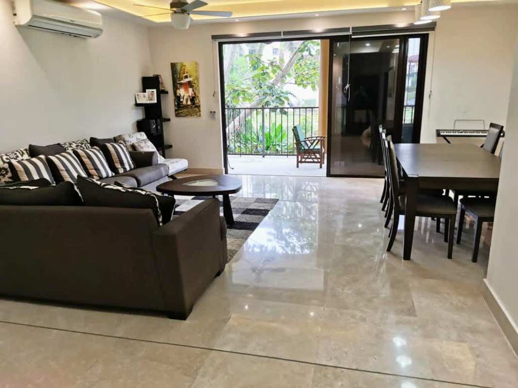 Bright living dining room with garden view balcony Embassy Club Panama City