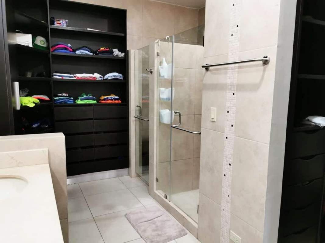 Master bedroom with garden access, neutral palette, natural light in Embassy Club Clayton Panama