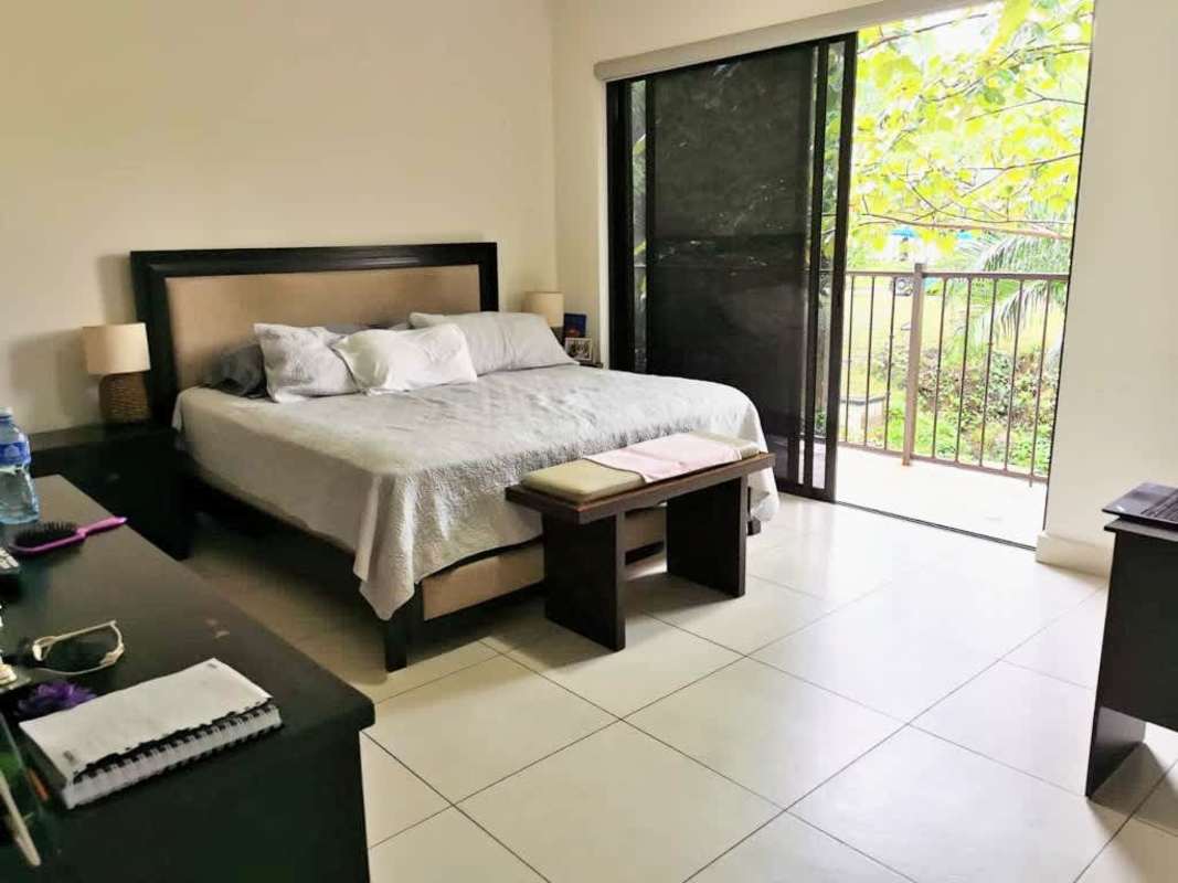 Spacious second bedroom with balcony, garden views Embassy Club Panama