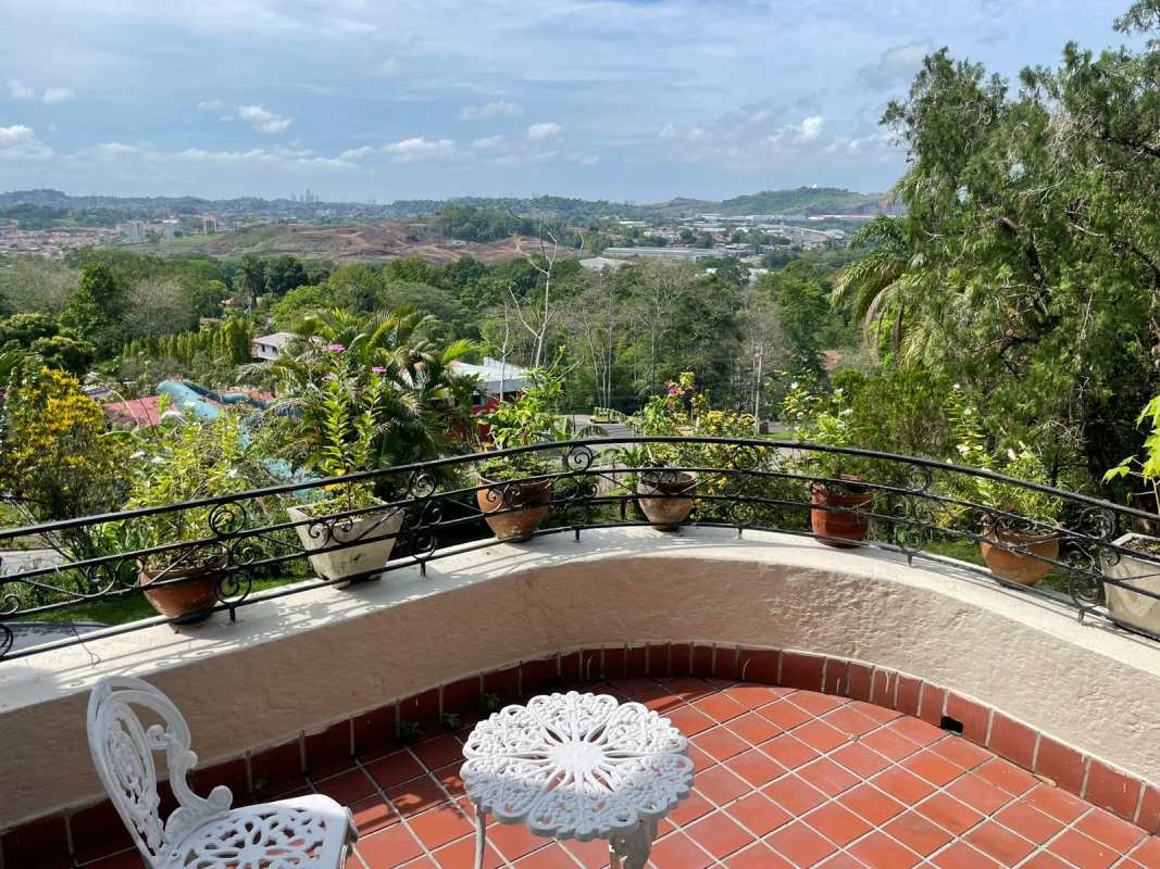 Lush garden view with patio, mature landscaping in Las Cumbres Panama house