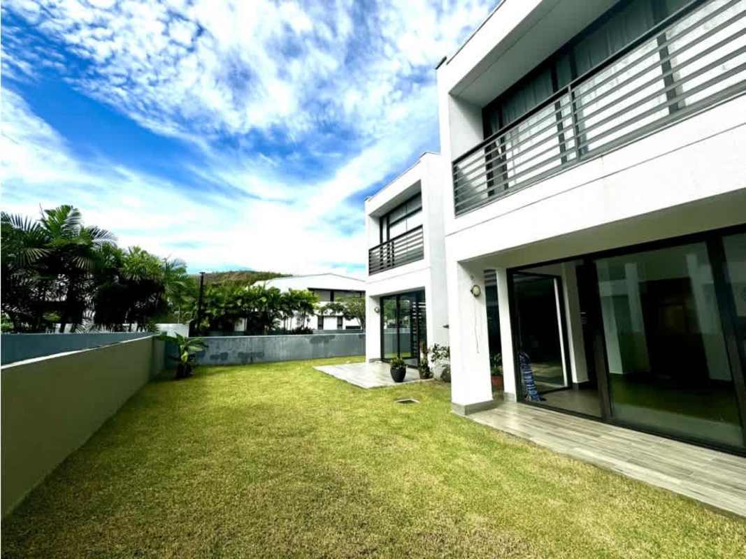Modern two-story facade with balconies and yard at Barrio Alto Altos de Panamá