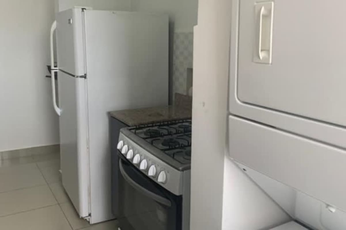 Minimalist kitchen with granite, stainless sink, fridge, gas stove Park Lefevre Panama