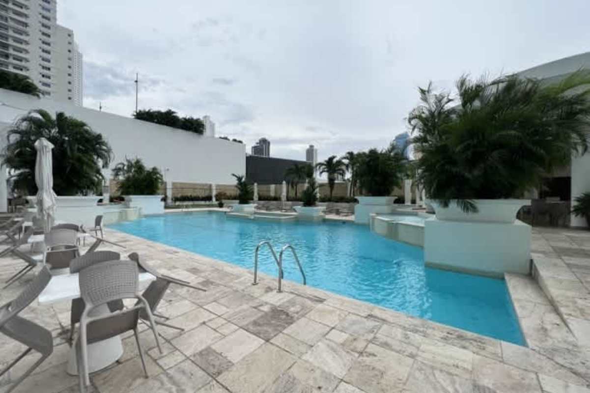 Luxury infinity swimming pool area overlooking ocean and skyline at PH Ocean Two in Costa del Este Panama