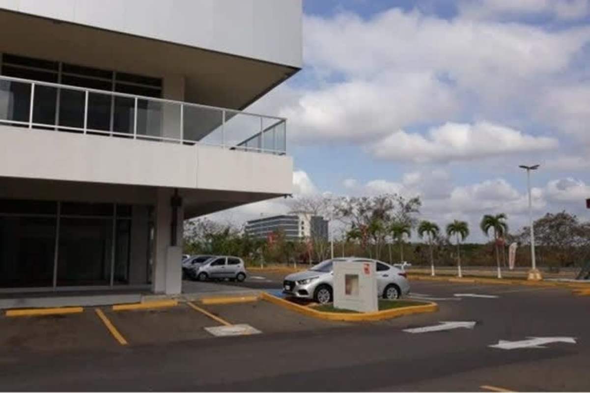 Entrance drive and large parking lot at Costa Sur Shopping Plaza Panama City
