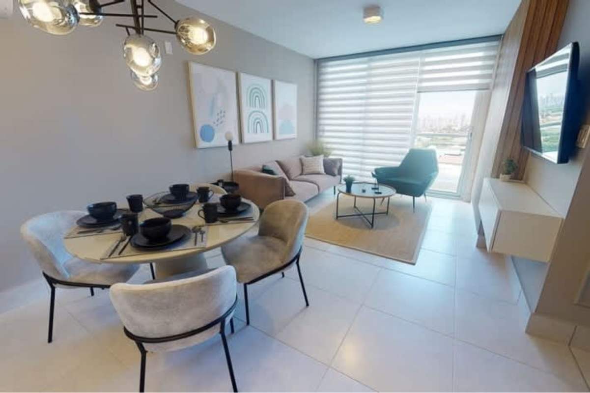 Open concept living dining area with modern lighting and city views PH Greenwood Tower