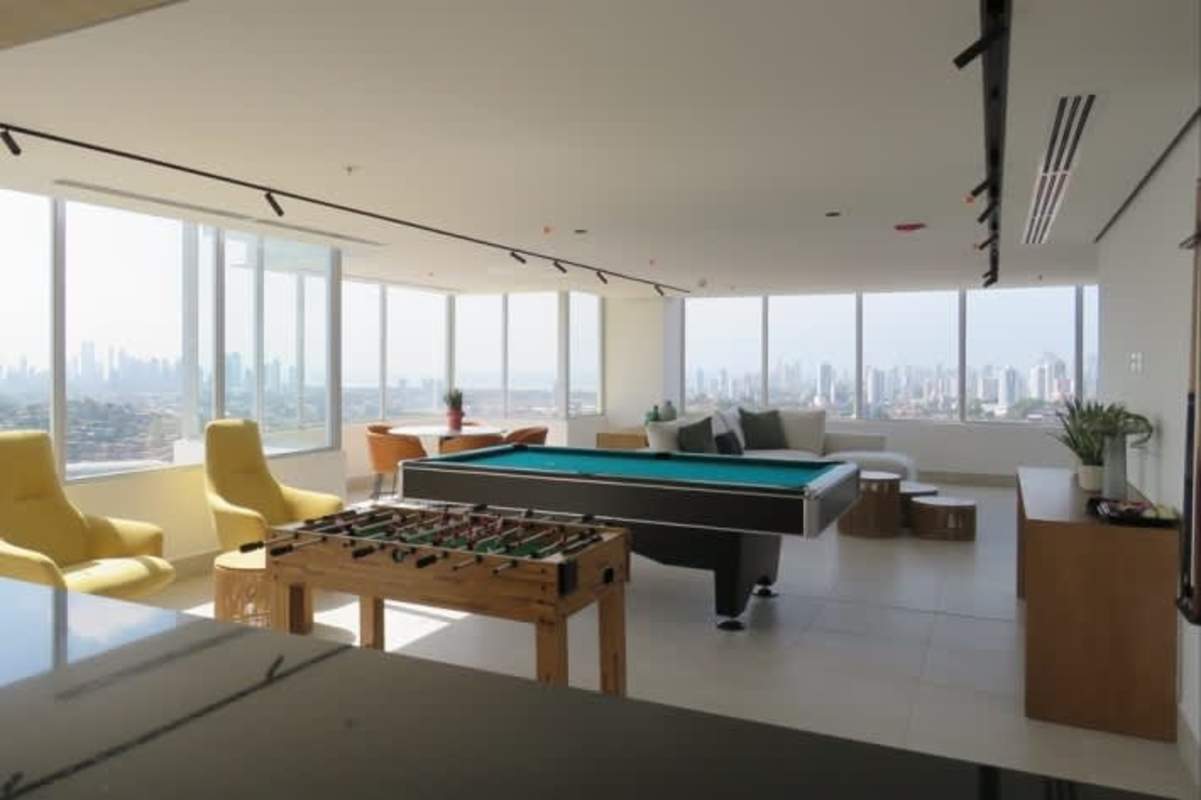 Game and lounge room with foosball, pool table, city view PH Greenwood Tower Panama City