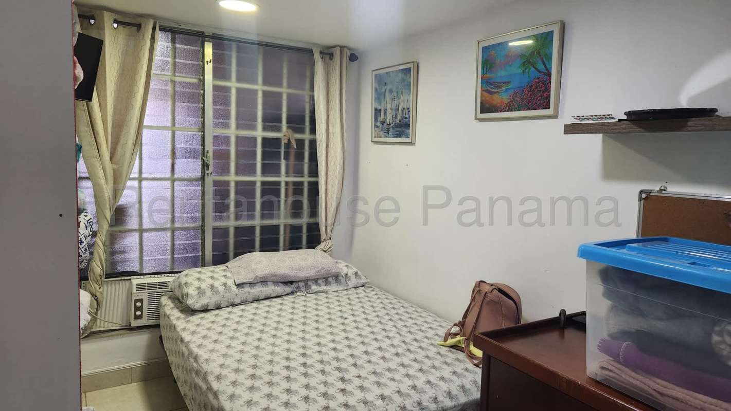Bedroom featuring split AC, ceiling fan, large window with natural light in Brisas del Golf Panama