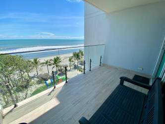 Covered balcony with furniture facing ocean in Sanctuary Playa Caracol Panama