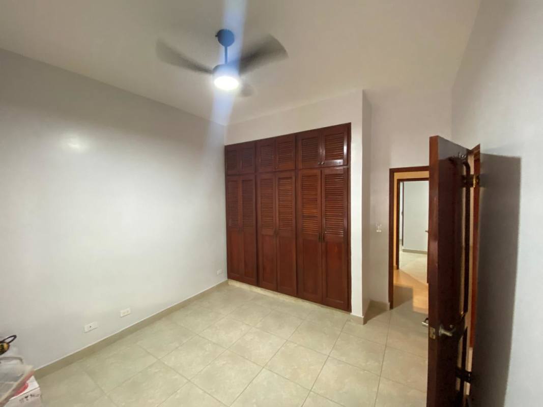 Open kitchen with wood cabinetry granite countertops large windows in house for rent Cardenas Panama