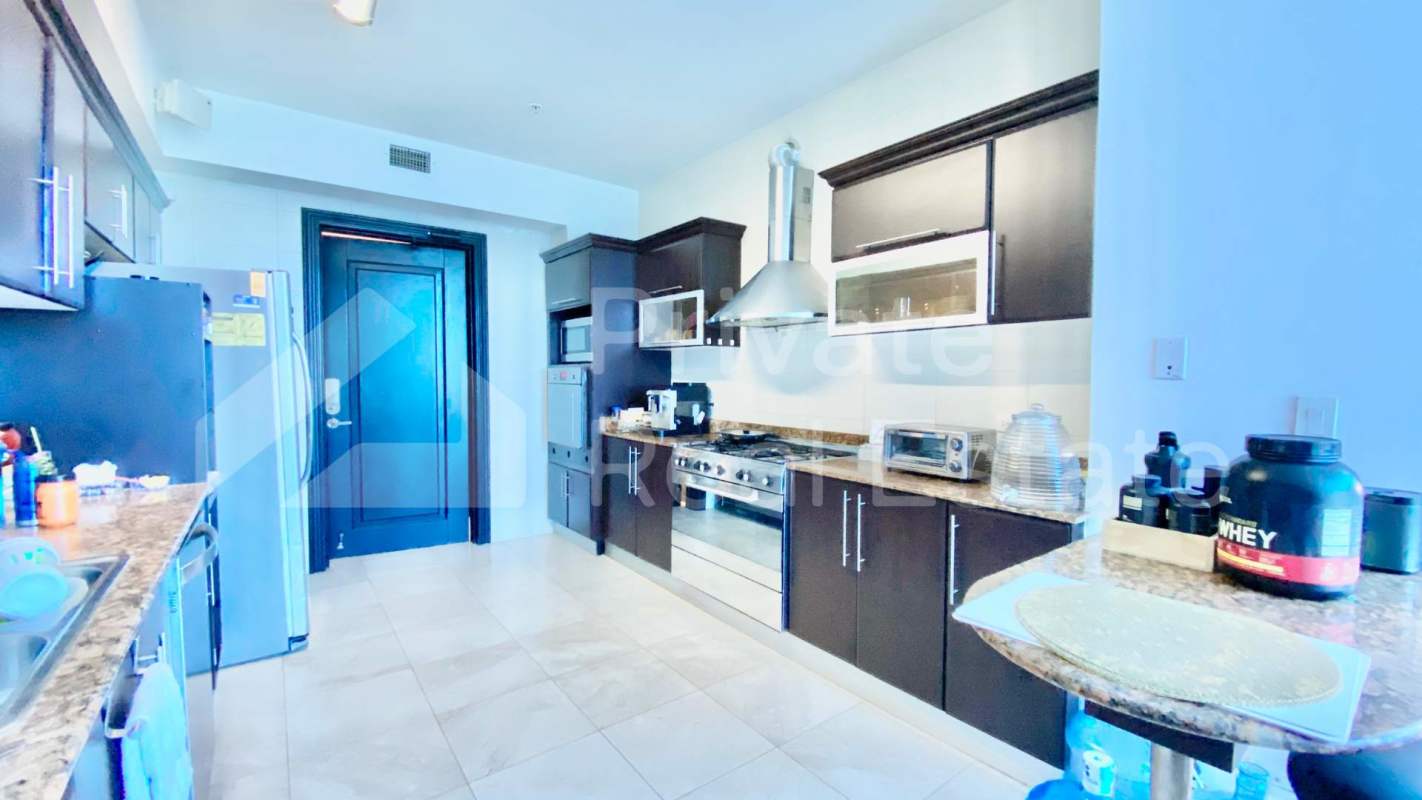 Modern fully equipped kitchen with granite tops in PH Ocean Two Costa del Este