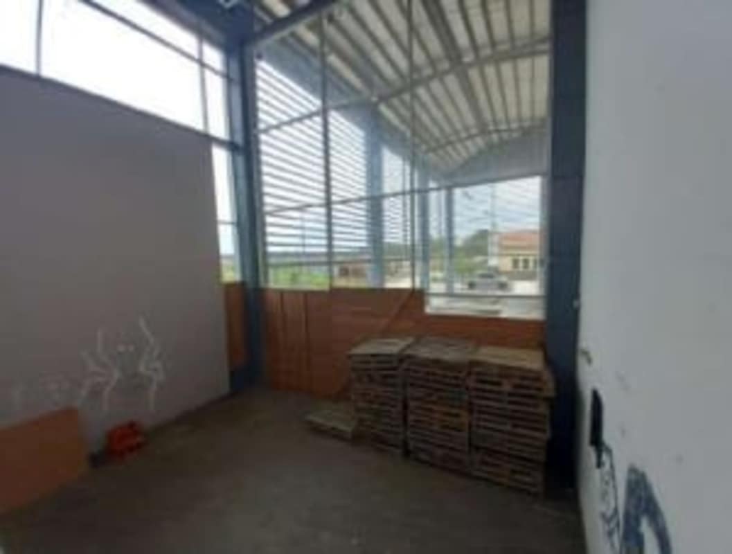 Warehouse storage space with high ceiling metal roofing and windows Tocumen Panama