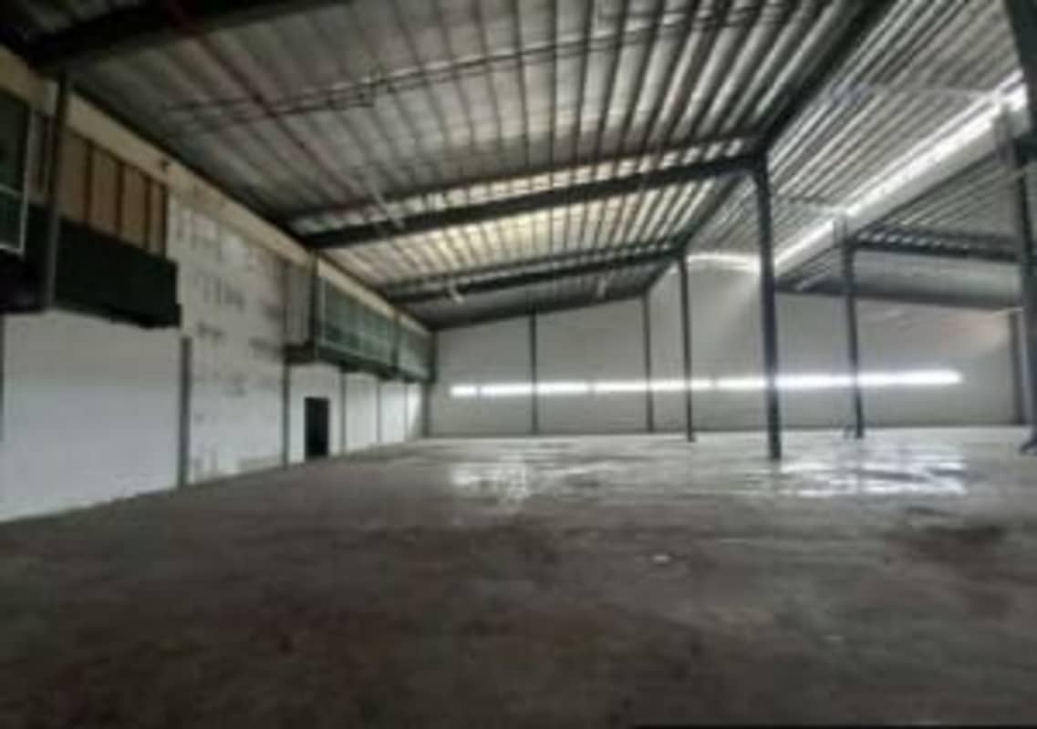 Spacious warehouse interior with mezzanine windows natural light Tocumen