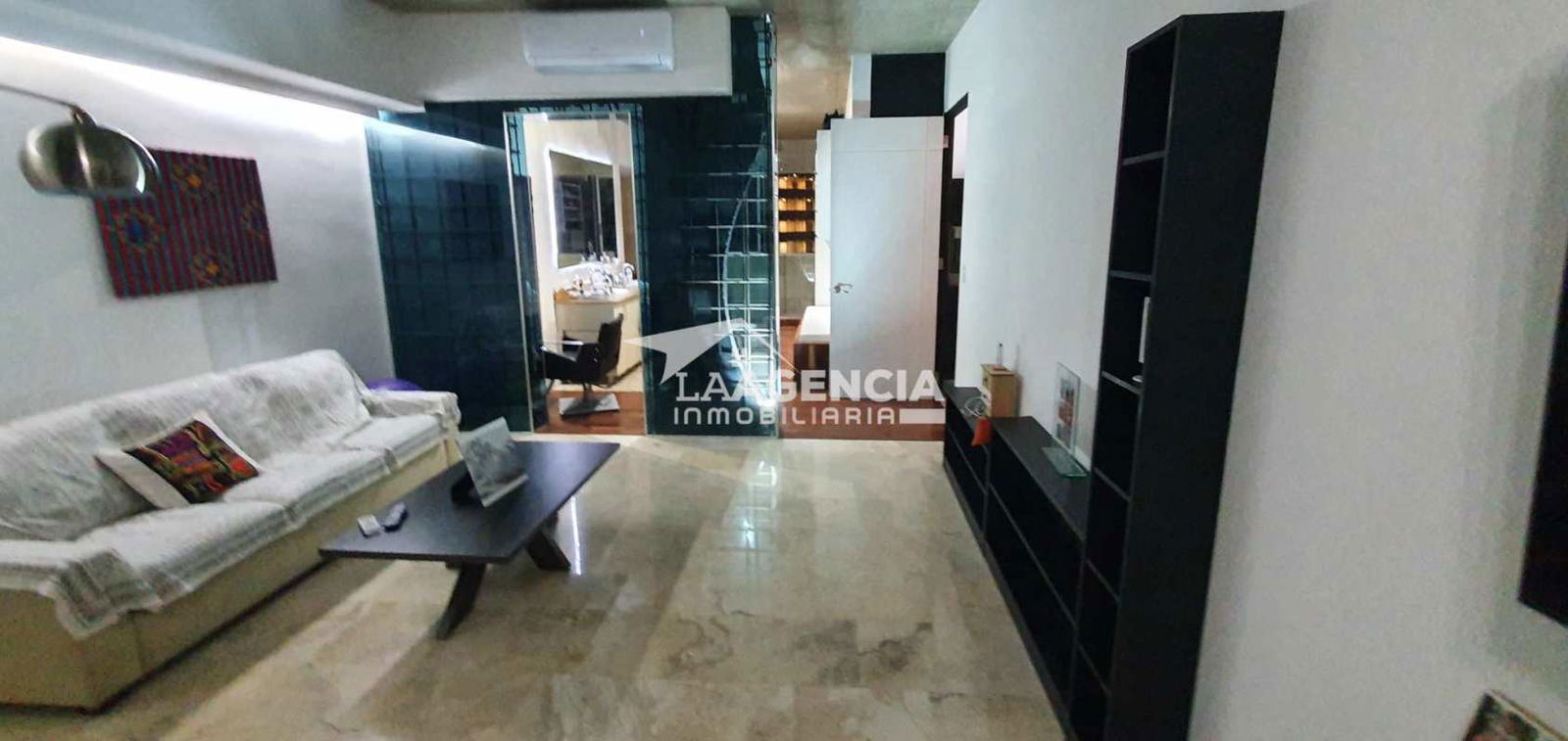 Dining with glass table, panoramic view, designer lighting in Punta Pacifica Penthouse