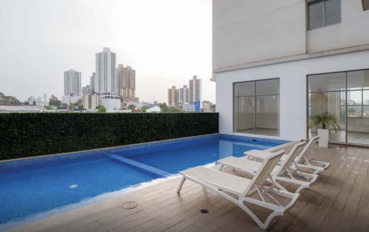 Family friendly outdoor pool and colorful playground at PH Áthas 12 de Octubre Panama City apartment for rent