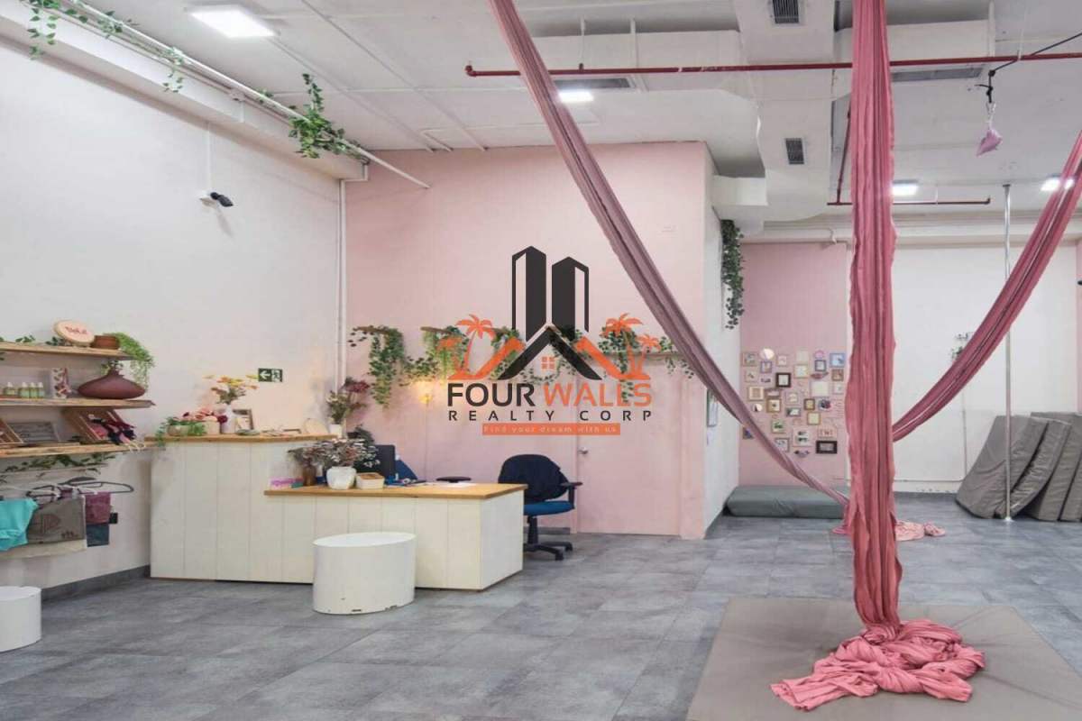 Yoga fitness studio with hanging silks, mirrored wall, industrial finish at Balboa Boutiques in Panama City