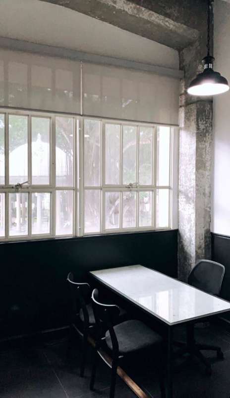 Private office with concrete beams, large windows, minimalist decor in Casco Viejo Panama