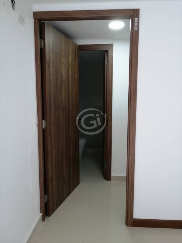 Interior hallway in PH Worldwide Plaza with wood trim leading to bedrooms and bathroom Panama City apartment