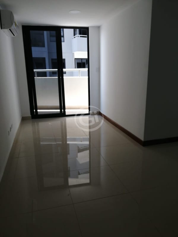Stylish bathroom with modern vanity, white tiles and walk-in shower in PH Worldwide Plaza apartment Panama City