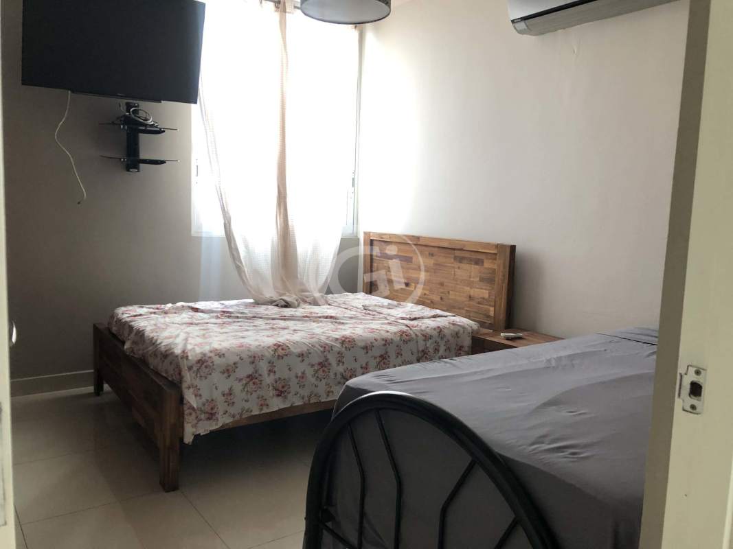 Elegant lobby with sofas, mirrors and flower decor PH Mont Royale El Cangrejo