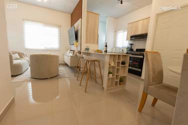 Open kitchen with island and dining space new affordable 2 bedroom house Villa Marinas La Chorrera